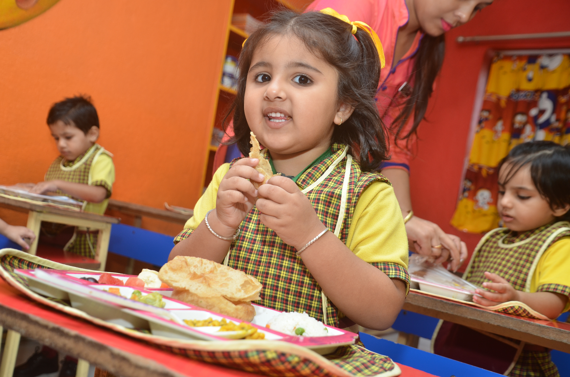 A child enjoying a fresh in-house meal